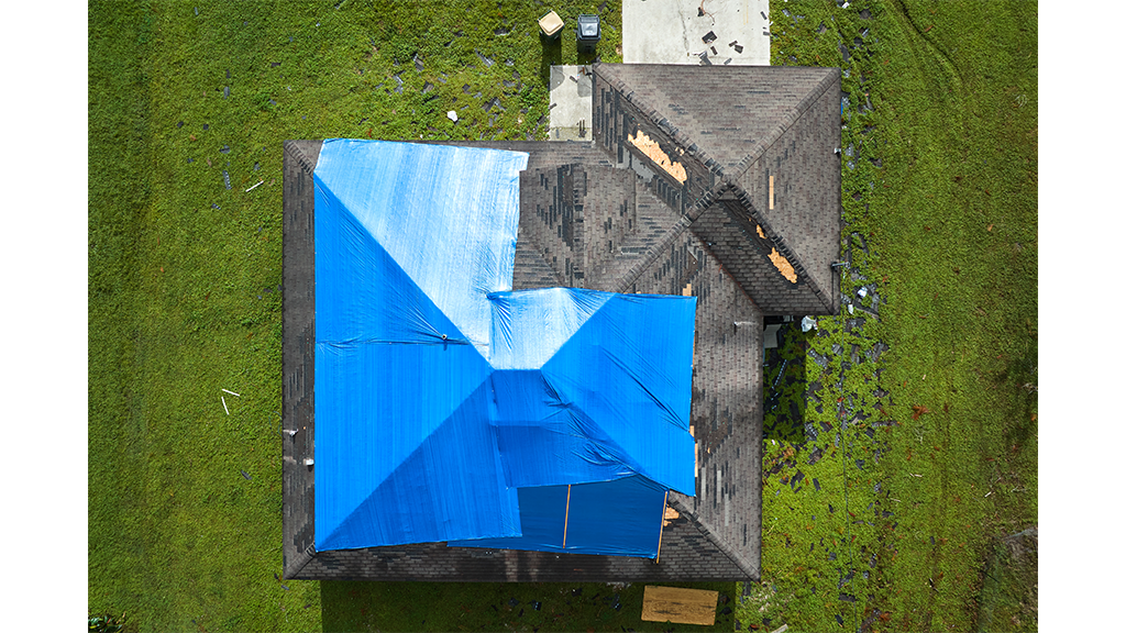 Tarp over a uk roof to stop leaks
