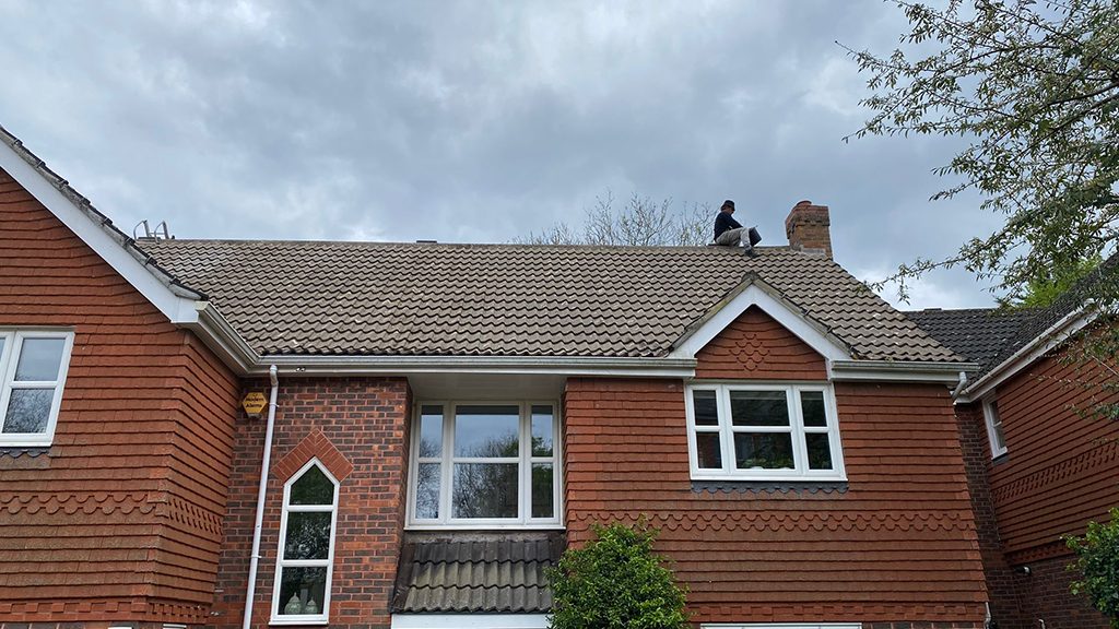 Finishing touches going onto a tile roof replacement by All Custom Roofing