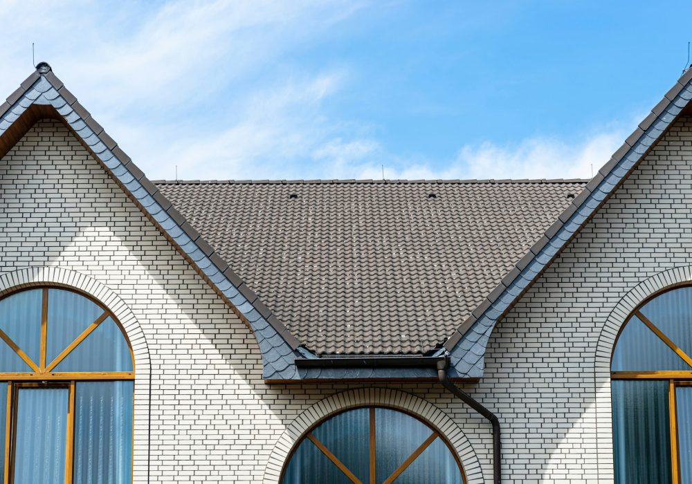 The church has a classic facade of white brick and a conical roof, visible large semicircular window